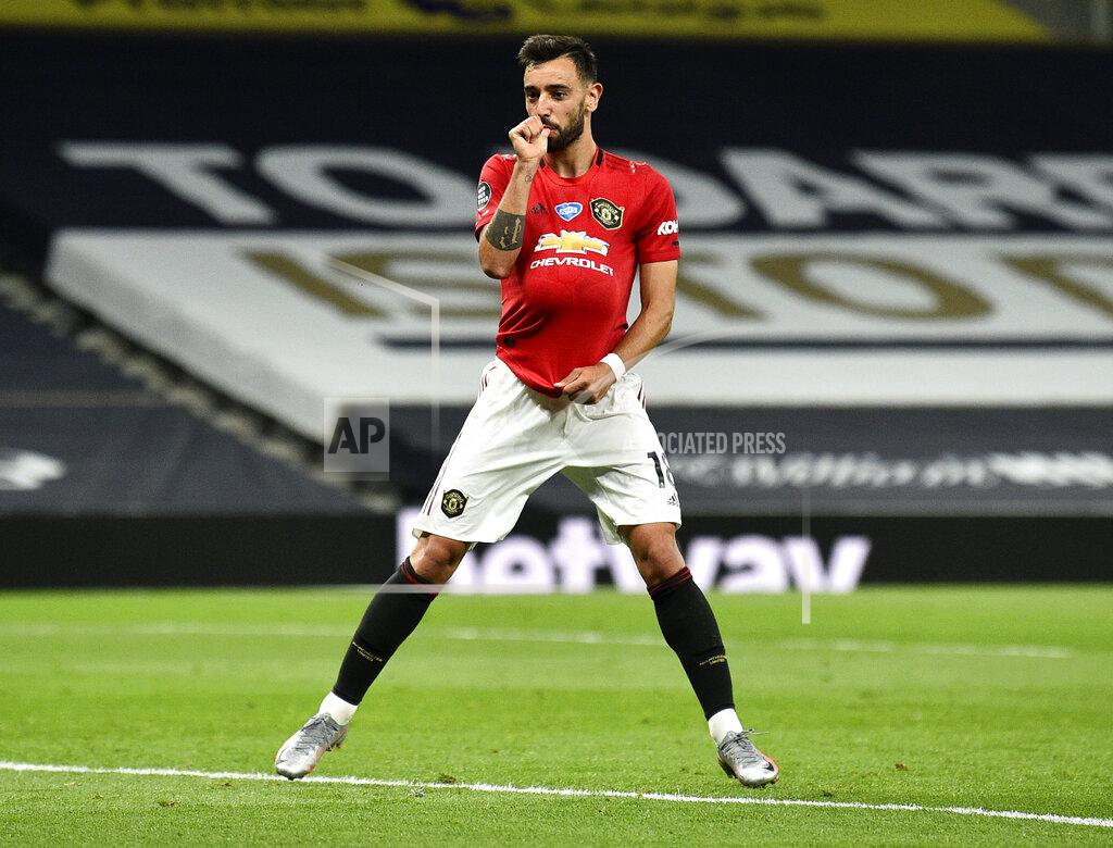 Glyn Kirk Manchester United's Bruno Fernandes reacts after kicking a penalty to level the scores during the English Premier League soccer match between Tottenham Hotspur and Manchester United at Tottenham Hotspur Stadium in London, England, Friday, June 19, 2020. (AP Photo/Glyn Kirk, Pool)