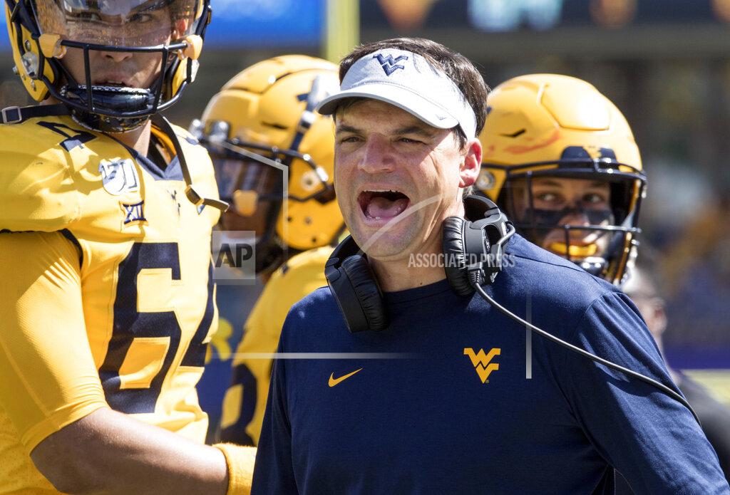 Ray Thompson West Virginia head coach Neal Brown yells at a referee during the second half of an NCAA college football game against North Carolina State Saturday, Sept. 14, 2019, in Morgantown, W.Va. (AP Photo/Raymond Thompson)
