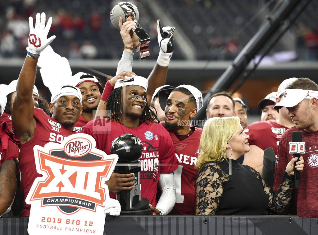Jeffrey Mcwhorter Oklahoma wide receiver CeeDee Lamb, center, holds the Most Outstanding Player award as he is congratulated by quarterback Jalen Hurts (1) after their 30-23 overtime victory over Baylor in an NCAA college football game for the Big 12 Conference championship, Saturday, Dec. 7, 2019, in Arlington, Texas. (AP Photo/Jeffrey McWhorter)