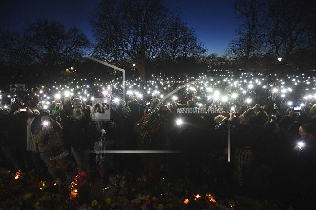 Victoria Jones People gather and turn on their phone torches in Clapham Common, despite the Reclaim These Streets vigil for Sarah Everard being officially cancelled, in London, Saturday, March 13, 2021. A serving British police officer accused of the kidnap and murder of a woman in London has appeared in court for the first time. Wayne Couzens, 48, is charged with kidnapping and killing 33-year-old Sarah Everard, who went missing while walking home from a friend’s apartment in south London on March 3. (Victoria Jones/PA via AP)