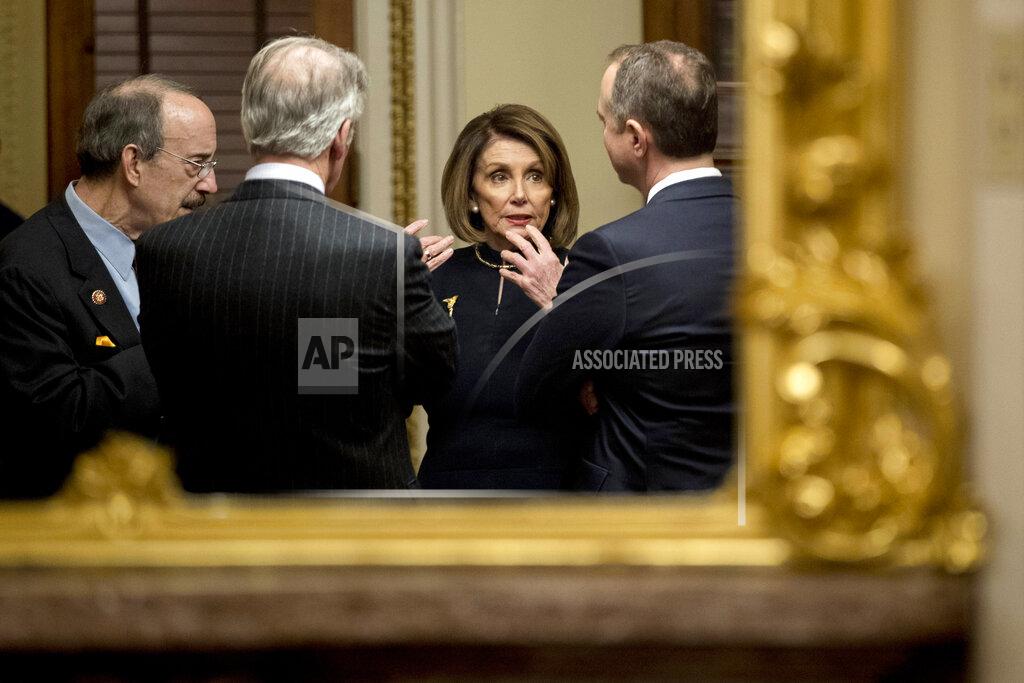 Andrew Harnik FILE - In this Wednesday, Dec. 18, 2019 file photo, House Speaker Nancy Pelosi of Calif., center, speaks with House Intelligence Committee Chairman Adam Schiff, D-Calif., right, House Foreign Affairs Committee Chairman Eliot Engel, D-N.Y., left, and House Ways and Means Committee Chairman Richard Neal, D-Mass., second from left, in a private room just off the House floor after the House votes to impeach President Donald Trump on Capitol Hill in Washington. On Friday, July 17, 2020, The Associated Press reported on this photo circulating online incorrectly asserting it shows the lawmakers without masks in mid-July 2020. The photo was taken in December 2019 before the first known case of coronavirus was reported in the U.S. (AP Photo/Andrew Harnik)