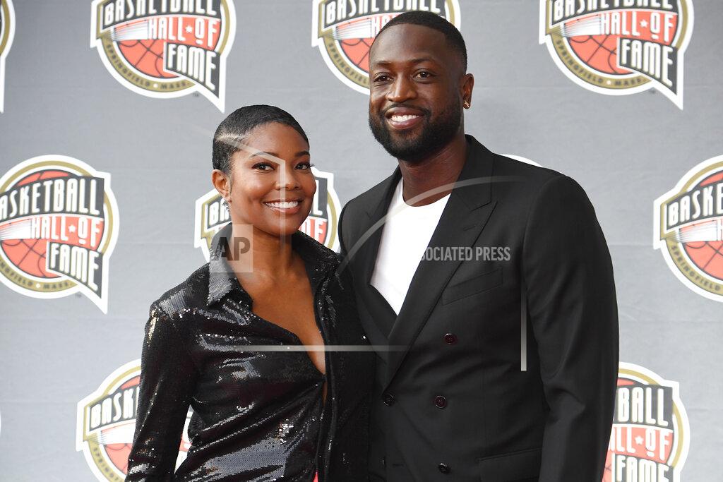 Jessica Hill Gabrielle Union and Dwyane Wade pose for a photo on the red carpet for the 2021 Basketball Hall of Fame Enshrinement ceremony, Saturday, Sept. 11, 2021, in Springfield, Mass. (AP Photo/Jessica Hill)