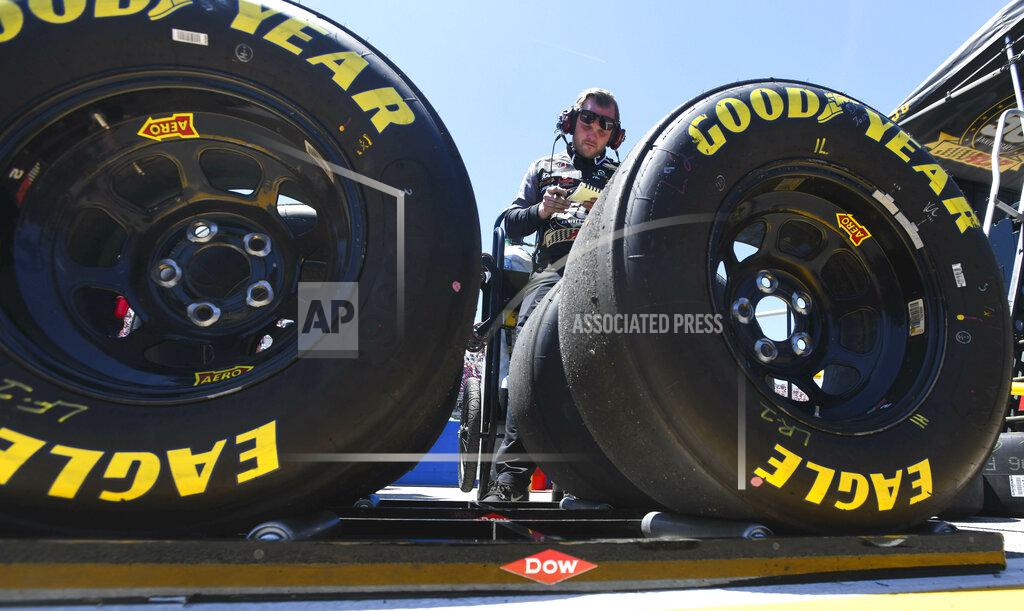 Julie Bennett A pit crew member for NASCAR Xfinity Series driver Tyler Reddick (2) checks tires during the NASCAR XFinity Series auto race, Saturday, April 27, 2019, at Talladega Superspeedway in Talladega, Ala. (AP Photo/Julie Bennett)