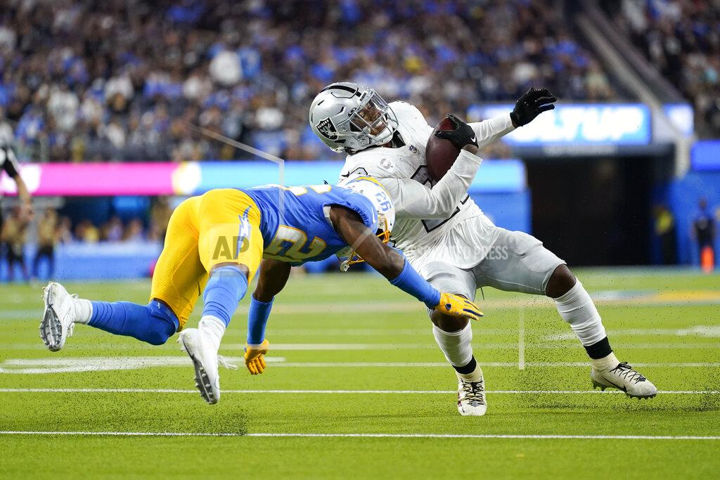 Ashley Landis Las Vegas Raiders running back Josh Jacobs, right, is hit by Los Angeles Chargers cornerback Asante Samuel Jr. during the second half of an NFL football game Monday, Oct. 4, 2021, in Inglewood, Calif. (AP Photo/Ashley Landis)