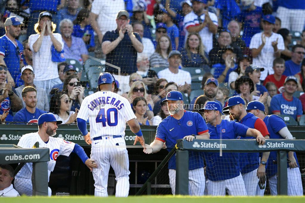 Paul Beaty Chicago Cubs' Willson Contreras (40) is greeted by manager David Ross, right, at the dugout after scoring against the Cincinnati Reds during the first inning of a baseball game Wednesday, June 29, 2022, in Chicago. (AP Photo/Paul Beaty)