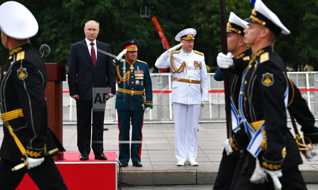 Alexei Nikolsky Russian President Vladimir Putin, left, Russian Defense Minister Sergei Shoigu, center, and Admiral Nikolai Yevmenov, Commander-in-Chief of the Russian Navy, attend the Navy Day parade in St. Petersburg, Russia, Sunday, July 25, 2021. (Alexei Nikolsky, Sputnik, Kremlin Pool Photo via AP)