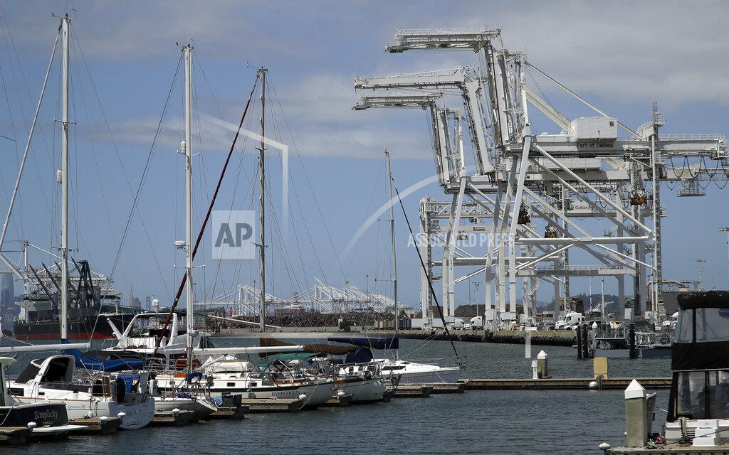 Ben Margot FILE - In this Friday, May 17, 2019, file photo, shipping cranes and a marina are near the Howard terminal area of the Port of Oakland in Oakland, Calif. The Oakland City Council approved preliminary terms for a new $12 billion waterfront ballpark project for the Athletics, Tuesday, July 20, 2021. But it's not clear if the 6-1 vote will be enough to keep the A's at the negotiating table instead of leaving the city. (AP Photo/Ben Margot, File)