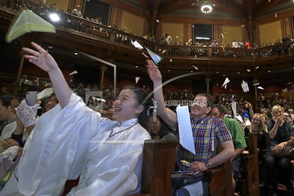 Elise Amendola FILE - In this Sept. 12, 2019 file photo, audience members toss paper airplanes at the 29th annual Ig Nobel awards ceremony at Harvard University, in Cambridge, Mass. The spoof prizes for weird and sometimes head-scratching scientific achievement will be presented online in 2021 due to the coronavirus pandemic. (AP Photo/Elise Amendola, File)