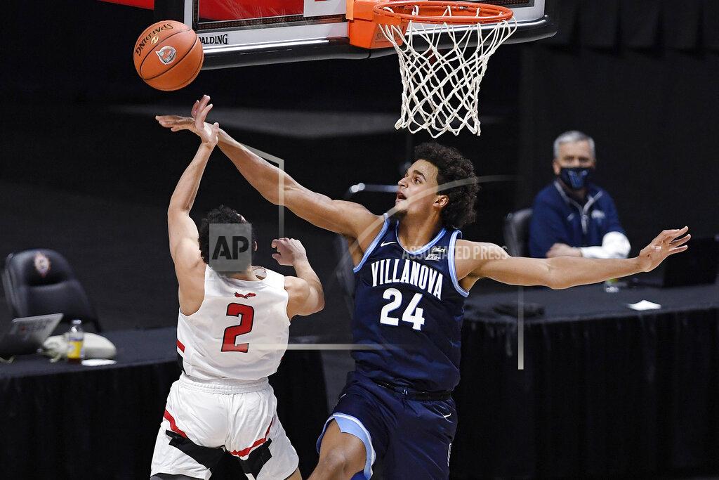 Jessica Hill Villanova's Jeremiah Robinson-Earl (24) blocks a shot by Hartford's D.J. Mitchell (2) in the first half of an NCAA college basketball game, Tuesday, Dec. 1, 2020, in Uncasville, Conn. (AP Photo/Jessica Hill)
