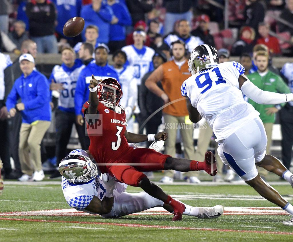 Timothy D. Easley Louisville quarterback Malik Cunningham (3) attempts a pass while being brought down by Kentucky linebacker Josh Allen (41) during the first half of an NCAA college football game in Louisville, Ky., Saturday, Nov. 24, 2018. (AP Photo/Timothy D. Easley)
