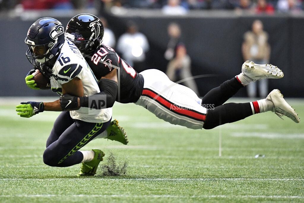 Danny Karnik Seattle Seahawks wide receiver Tyler Lockett (16) makes the catch against Atlanta Falcons defensive back Kendall Sheffield (20) during the second half of an NFL football game, Sunday, Oct. 27, 2019, in Atlanta. The Seattle Seahawks won 27-20. (AP Photo/Danny Karnik)