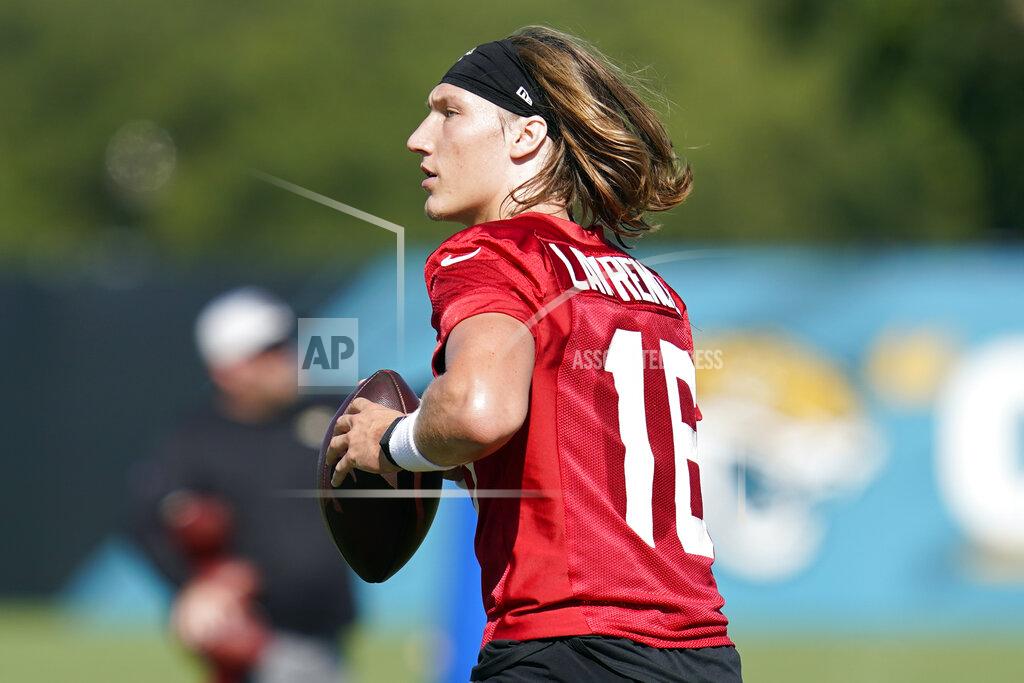 John Raoux Jacksonville Jaguars quarterback Trevor Lawrence performs a drill during NFL football practice, Saturday, July 31, 2021, in Jacksonville, Fla. (AP Photo/John Raoux)