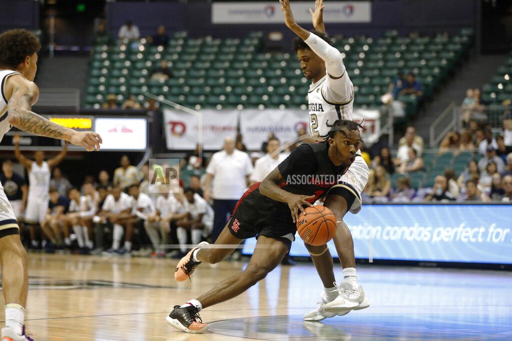 Marco Garcia Houston guard DeJon Jarreau (3) dribbles past Georgia Tech forward Khalid Moore (12) during the second half of an NCAA college basketball game Monday, Dec. 23, 2019, in Honolulu. (AP Photo/Marco Garcia)