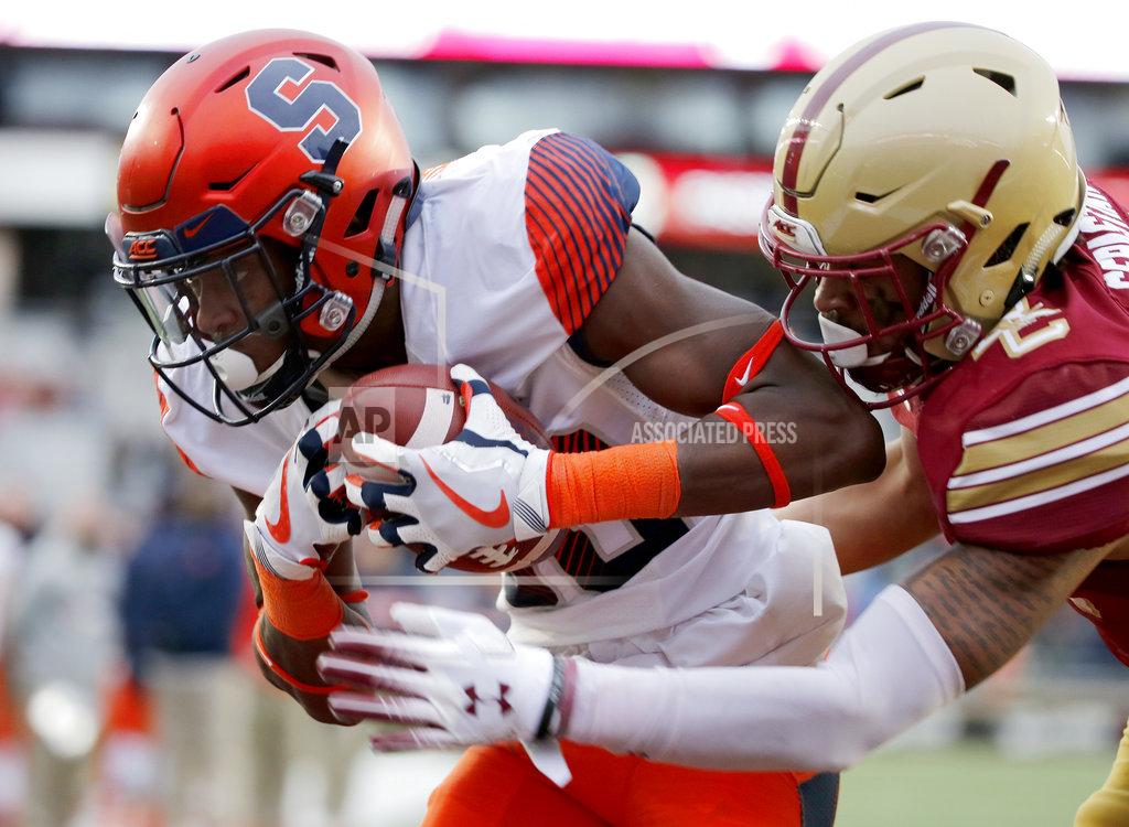 Mary Schwalm Syracuse wide receiver Taj Harris (80) catches a pass for a touchdown ahead of Boston College defensive back Brandon Sebastian (10) during the second half of an NCAA college football game, Saturday, Nov. 24, 2018, in Boston. (AP Photo/Mary Schwalm)