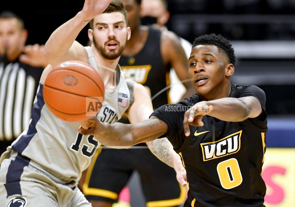 Abby Drey VCU's Jamir Watkins passes the ball as Penn State's Trent Buttrickduring an NCAA college basketball game Wednesday, Dec. 2, 2020, in State College, Pa. (Abby Drey/Centre Daily Times via AP)
