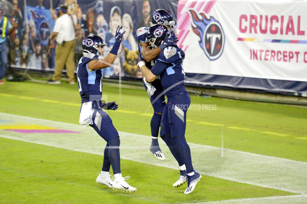 Mark Zaleski Tennessee Titans quarterback Ryan Tannehill (17) is congratulated after scoring a touchdown on a 10-yard run against the Buffalo Bills in the first half of an NFL football game Tuesday, Oct. 13, 2020, in Nashville, Tenn. (AP Photo/Mark Zaleski)