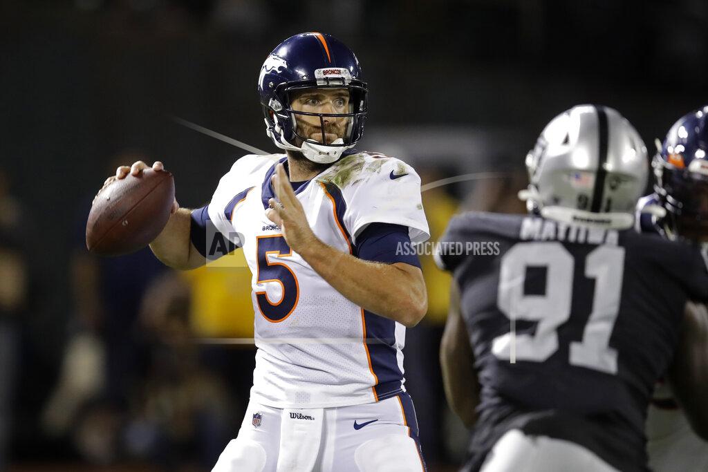 Ben Margot Denver Broncos quarterback Joe Flacco looks to throw as Oakland Raiders defensive end Benson Mayowa (91) looks on during the second half of an NFL football game Monday, Sept. 9, 2019, in Oakland, Calif. (AP Photo/Ben Margot)