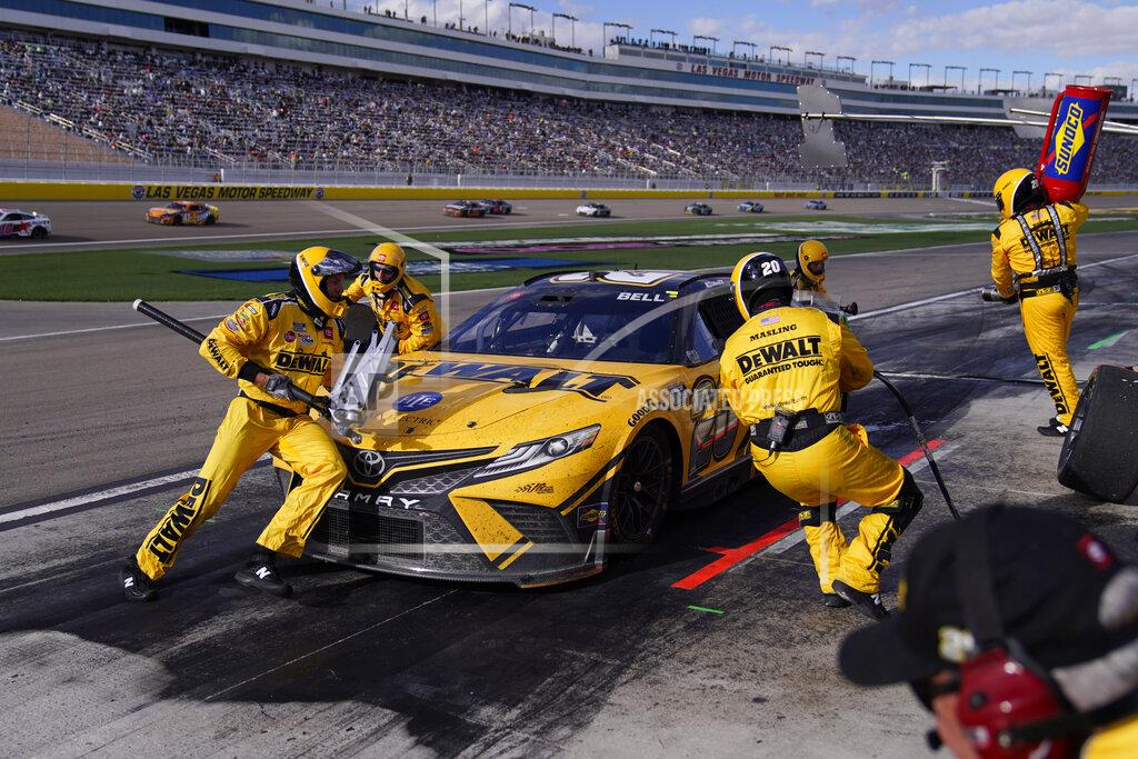 John Locher Christopher Bell (20) makes a pit stop during a NASCAR Cup Series auto race Sunday, March 6, 2022, in Las Vegas. (AP Photo/John Locher)