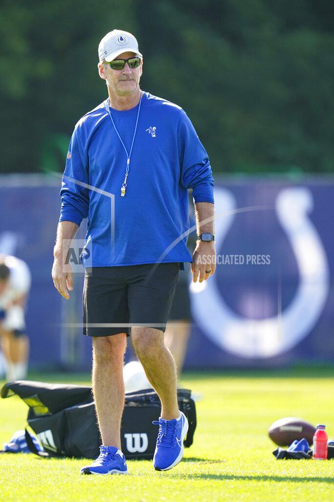 Michael Conroy Indianapolis Colts head coach Frank Reich walks on the field before the start of practice at the NFL team's football training camp in Westfield, Ind., Monday, Aug. 2, 2021. Reich returned to practice following his quarantine period and two negative tests after a positive test for COVID-19. (AP Photo/Michael Conroy)