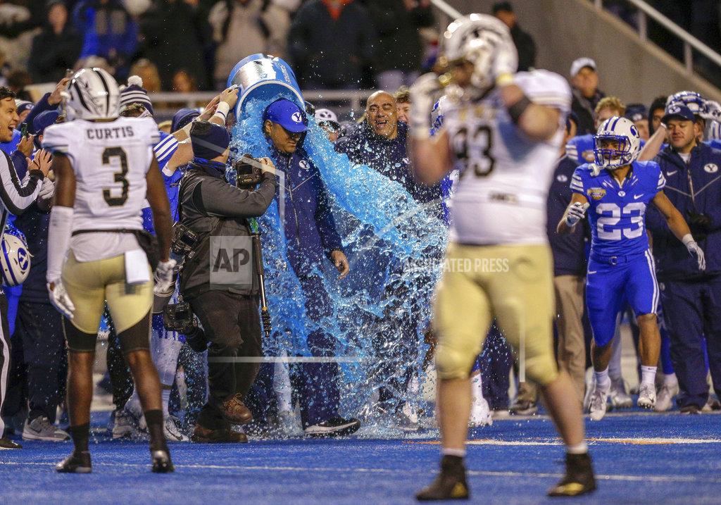 Steve Conner BYU coach Kalani Sitake is doused at the end of the team's 49-18 win over Western Michigan in the Famous Idaho Potato Bowl NCAA college football game Friday, Dec. 21, 2018, in Boise, Idaho. (AP Photo/Steve Conner)
