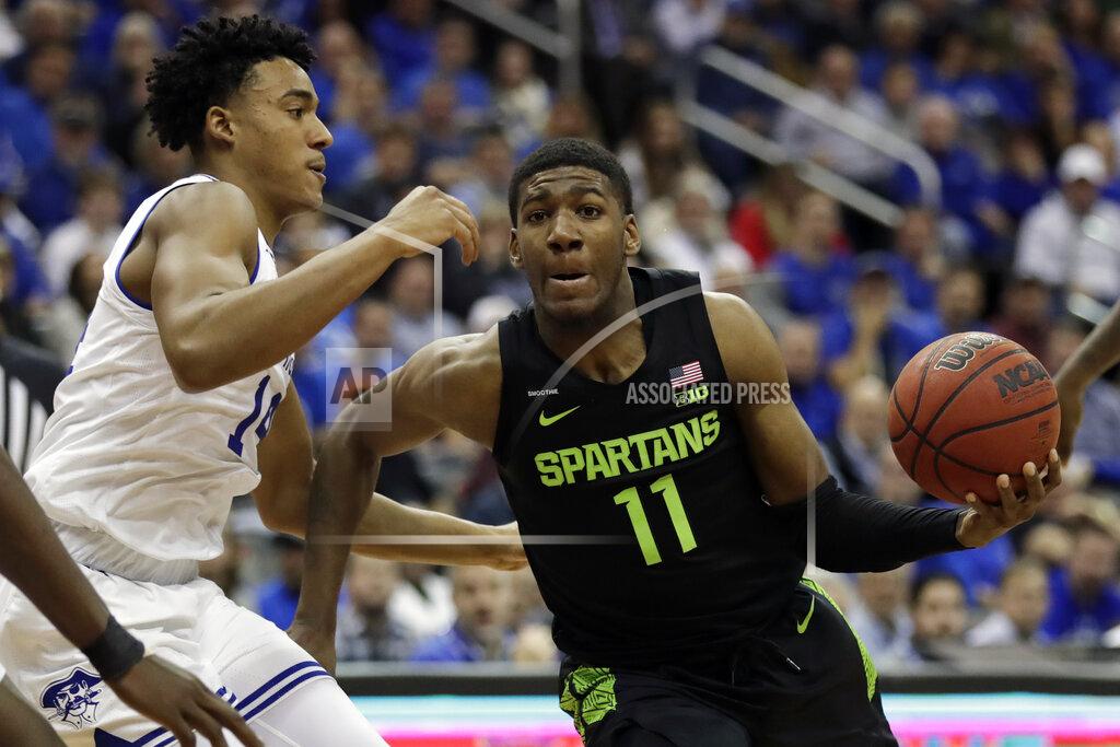Adam Hunger Michigan State forward Aaron Henry (11) drives to the basket past Seton Hall guard Jared Rhoden during the first half of an NCAA college basketball game Thursday, Nov. 14, 2019, in Newark, N.J. (AP Photo/Adam Hunger)