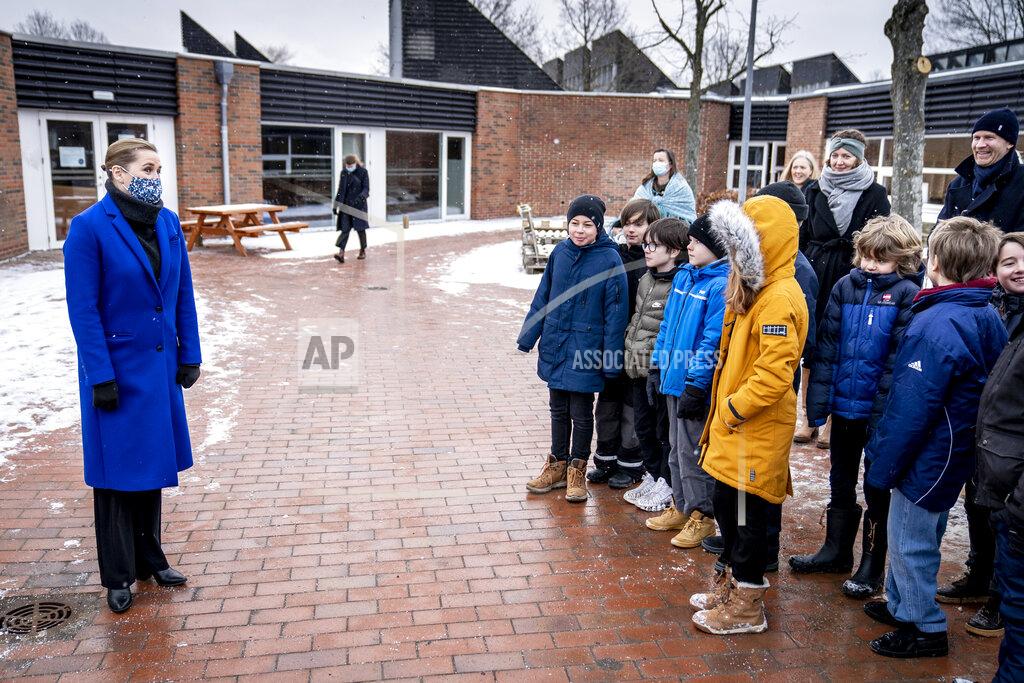 Mads Claus Rasmussen Pupils at Allerslev Skole speak to Denmark'sPrime Minister Mette Frederiksen, left, on their first day back at school, in Lejre, on the island of Sealand, Denmark, Monday, Feb. 8, 2021. Students in the lower grades returned to the classrooms after schools were closed in an effort to control the spread of coronavirus. Denmark's Prime Minister Mette Frederiksen said Monday it was uncertain when older students would return to school. (Mads Claus Rasmussen/Ritzaus Scanpix via AP)