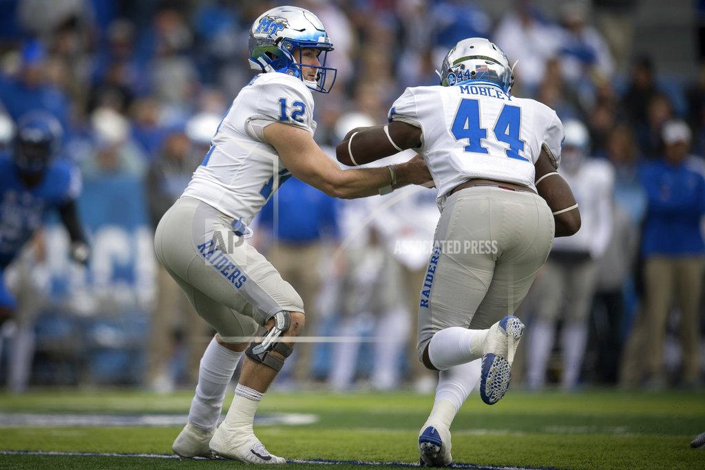Bryan Woolston Middle Tennessee quarterback Brent Stockstill (12) hands the ball off too Middle Tennessee running back Chaton Mobley (44) during the first half of an NCAA college football game against Kentucky in Lexington, Ky., Saturday, Nov. 17, 2018. (AP Photo/Bryan Woolston)