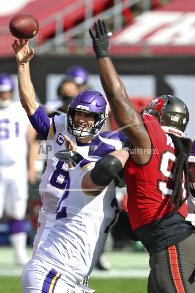 Mark Lomoglio Minnesota Vikings quarterback Kirk Cousins (8) throws a pass as he is pressured by Tampa Bay Buccaneers nose tackle Steve McLendon (96) during the first half of an NFL football game Sunday, Dec. 13, 2020, in Tampa, Fla. (AP Photo/Mark LoMoglio)