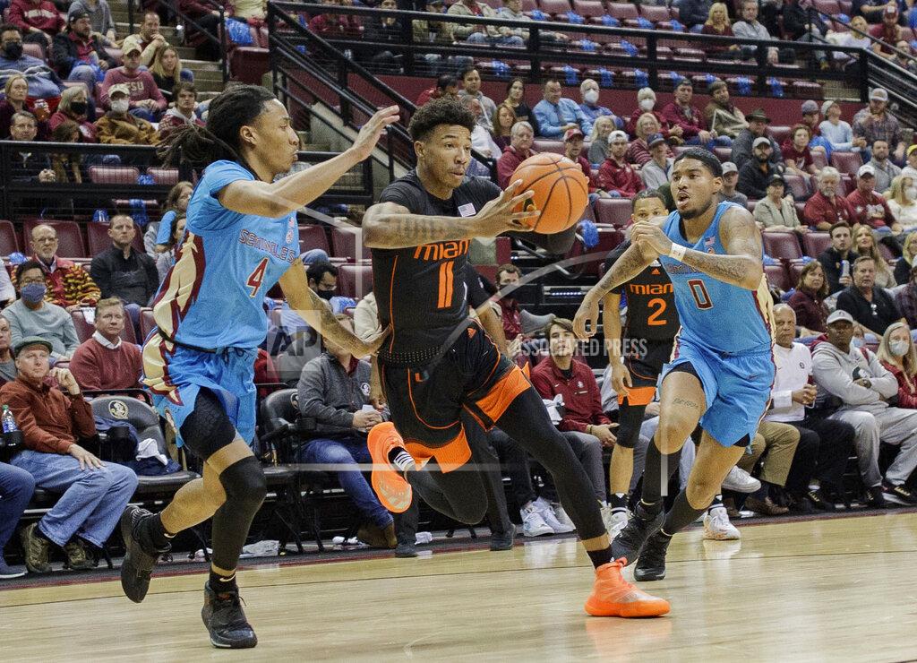 Alicia Devine Miami guard Jordan Miller (11) passes to a teammate during an NCAA college basketball game against Florida State at the Tucker Civic Center on Tuesday, Jan. 11, 2022, Tallahassee, Fla. (Alicia Devine/Tallahassee Democrat via AP)