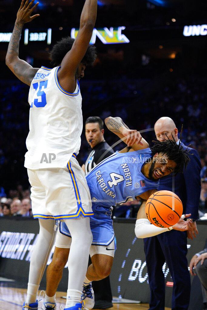 Chris Szagola North Carolina's R.J. Davis, right, is fouled by UCLA's Myles Johnson during the first half of a college basketball game in the Sweet 16 round of the NCAA tournament, Friday, March 25, 2022, in Philadelphia. (AP Photo/Chris Szagola)