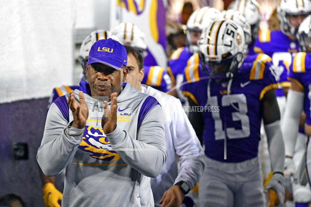 Hilary Scheinuk LSU wide receivers coach Mickey Joseph leads players onto the field before an NCAA college football game against Louisiana-Monroe, on Saturday, Nov. 20, 2021, at Tiger Stadium in Baton Rouge, La. Joseph, who coached wide receivers the last five seasons at LSU, will return to Nebraska as receivers coach, passing game coordinator and associate head coach under Scott Frost. (Hilary Scheinuk/The Advocate via AP)
