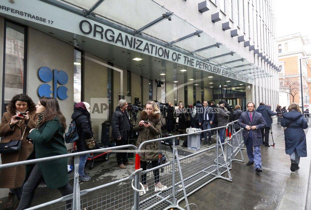 Ronald Zak FILE - In this file photo dated Friday, March 6, 2020, before the coronavirus pandemic restrictions, people stand outside the headquarters of the Organization of the Petroleum Exporting Countries, OPEC, in Vienna, Austria. Members of oil producer cartel OPEC and allied countries are meeting online Thursday March 4, 2021, considering a possible increase in production now that prices have recovered to near their pre-pandemic levels. (AP Photo/Ronald Zak, FILE)