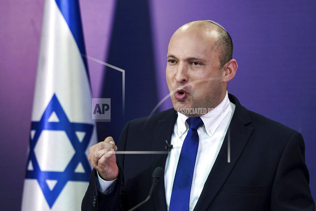 Menahem Kahana Naftali Bennett, Israeli parliament member from the Yamina party, gives a statement at the Knesset, Israel's parliament, in Jerusalem, Sunday, June 6, 2021. (Menahem Kahana/Pool via AP)