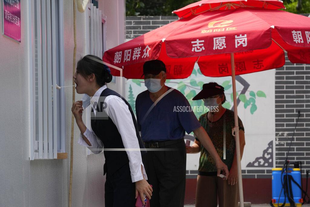 Ng Han Guan A resident gets swabbed during mass COVID test on Monday, May 23, 2022, in Beijing. (AP Photo/Ng Han Guan)