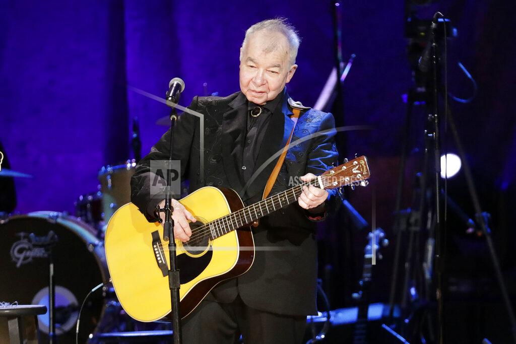 Wade Payne FILE — In this Sept. 11, 2019, file photo, John Prine performs at the Americana Honors & Awards show in Nashville, Tenn. Prine was named artist of the year at the Americana Honors and Awards. The Americana Music Association announced the winners online this year after their awards show, normally held in Nashville, Tennessee, was cancelled because of the pandemic. Prine died April 7, 2020, from complications of the coronavirus. He was 73. (AP Photo/Wade Payne, File)