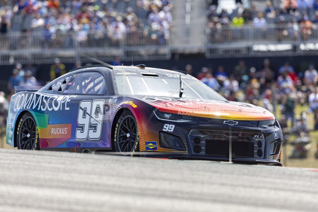 Stephen Spillman Daniel Suarez steers through Turn 1 during a NASCAR Cup Series auto race at Circuit of the Americas, Sunday, March 27, 2022, in Austin, Texas. (AP Photo/Stephen Spillman)