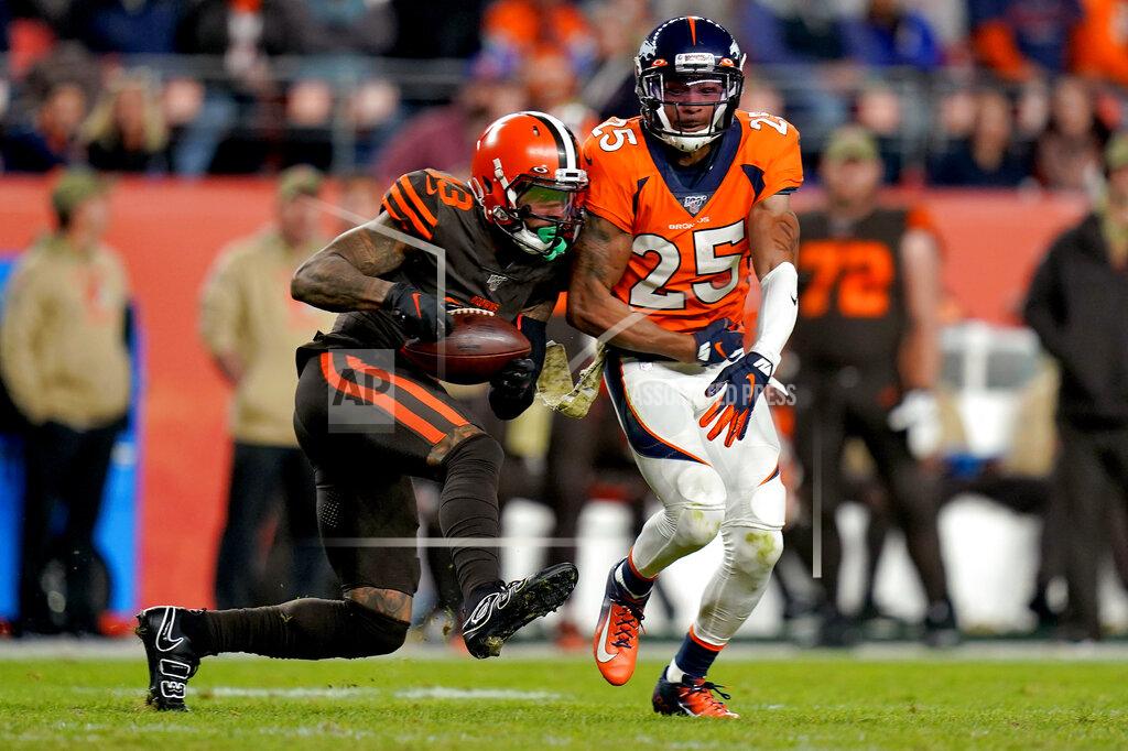 Jack Dempsey Cleveland Browns wide receiver Odell Beckham (13) pulls in a catch as Denver Broncos cornerback Chris Harris (25) defends during the second half of an NFL football game against the Cleveland Browns, Sunday, Nov. 3, 2019, in Denver. The Broncos won 24-19. (AP Photo/Jack Dempsey)