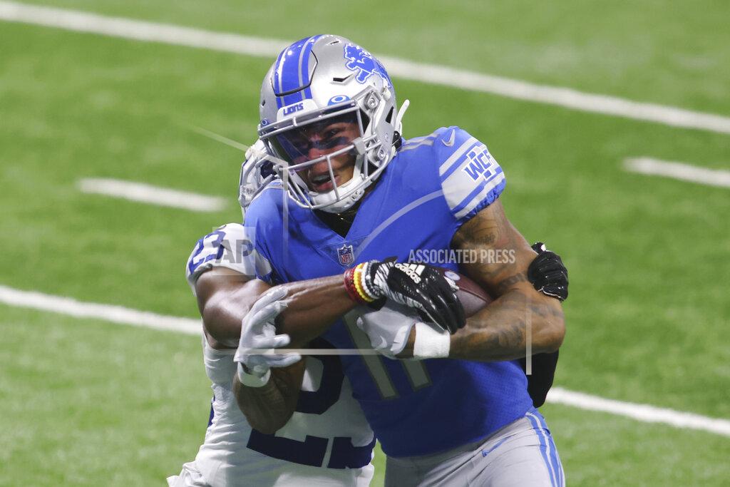 Tony Ding Detroit Lions wide receiver Marvin Jones (11) is tackled by Indianapolis Colts cornerback Kenny Moore II (23) as they fall into the end zone for a touchdown during the first half of an NFL football game, Sunday, Nov. 1, 2020, in Detroit. (AP Photo/Tony Ding)