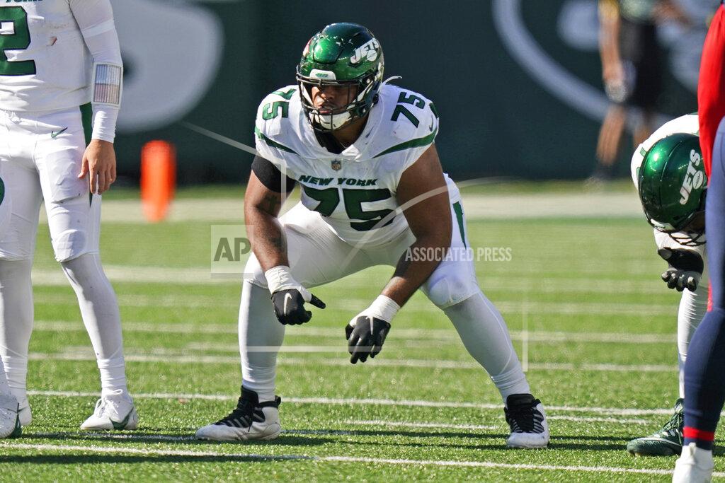 Frank Franklin Ii FILE - New York Jets' Alijah Vera-Tucker gets set during the second half of an NFL football game New England Patriots, Sept. 19, 2021, in East Rutherford, N.J. Vera-Tucker was taken in the NFL draft 12 spots after Zach Wilson when general manager Joe Douglas traded up to get him. And he has settled in as arguably New York's best offensive lineman this season. (AP Photo/Frank Franklin II, File)