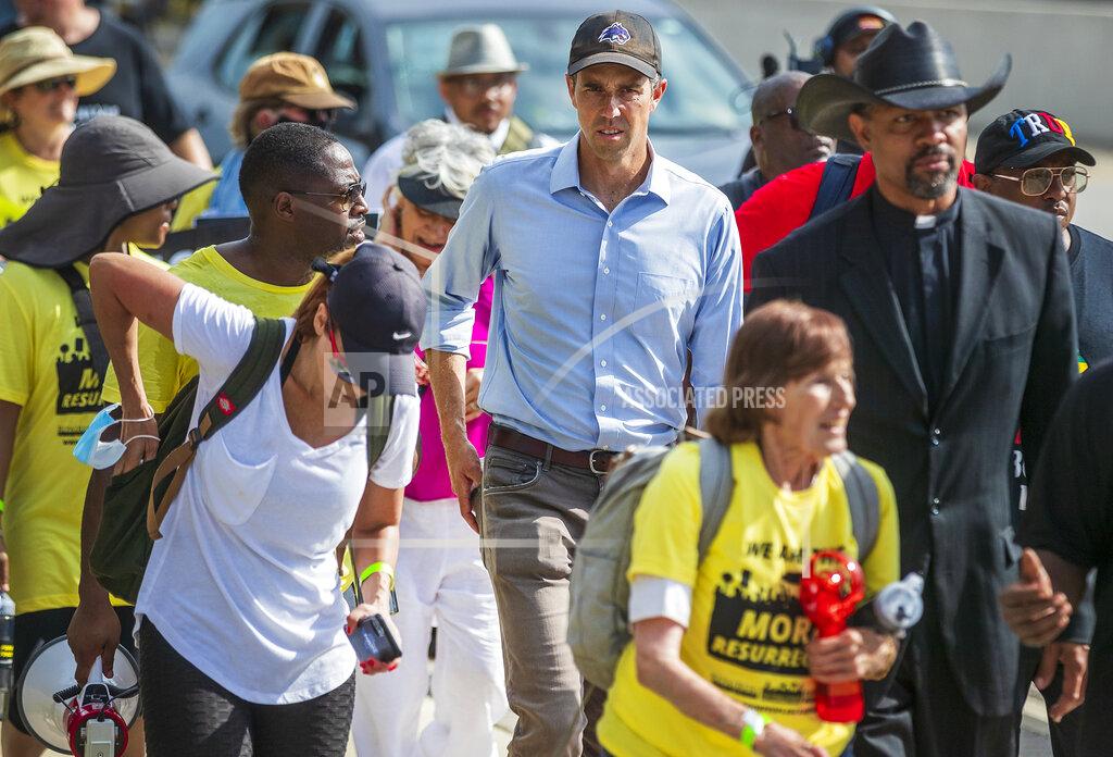 Ricardo B. Brazziell Former Democratic congressman and presidential candidate Beto O'Rourke walks along the service road of Interstate Highway 35, in Georgetown, Texas to participate in a Selma-style march for democracy from Georgetown, Texas to the Texas State Capitol in downtown Austin. On Wednesday, July 28, 2021 the group made a stop at Good Hope church in Round Rock and will end with a rally at the Capitol at 10 am on July 31st. (Ricardo B. Brazziell/Austin American-Statesman via AP)