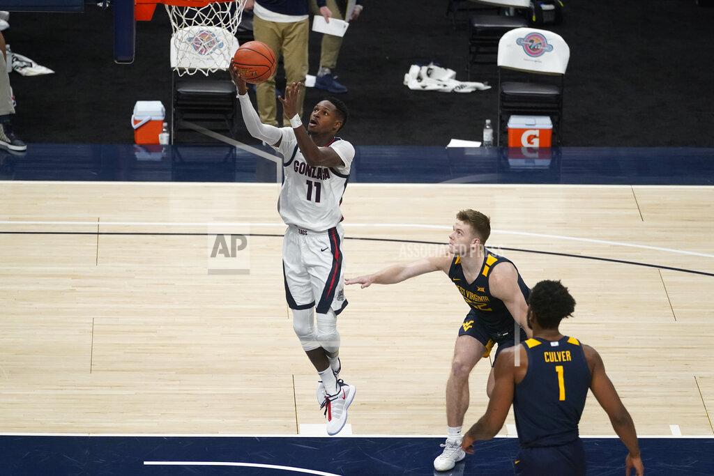Darron Cummings Gonzaga's Joel Ayayi (11) shoots as West Virginia's Sean McNeil (22) watches during the second half of an NCAA college basketball game Wednesday, Dec. 2, 2020, in Indianapolis. (AP Photo/Darron Cummings)