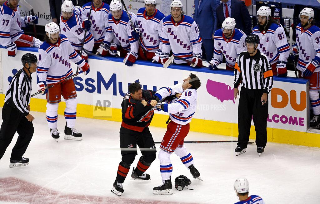 New York Rangers' Ryan Strome (16) fights with Carolina Hurricanes' Justin Williams during the first period in the NHL hockey Stanley Cup playoffs in Toronto, Saturday, Aug. 1, 2020. (Frank Gunn/The Canadian Press via AP)