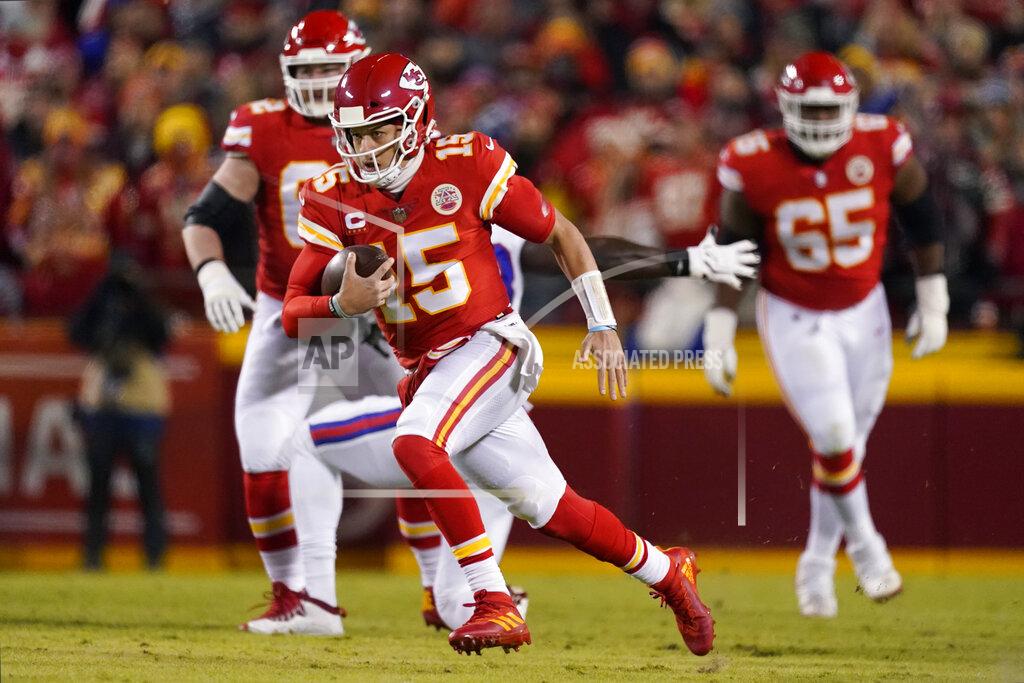 Charlie Riedel Kansas City Chiefs quarterback Patrick Mahomes (15) scrambles up field during the first half of an NFL divisional round playoff football game against the Buffalo Bills, Sunday, Jan. 23, 2022, in Kansas City, Mo. (AP Photo/Charlie Riedel)