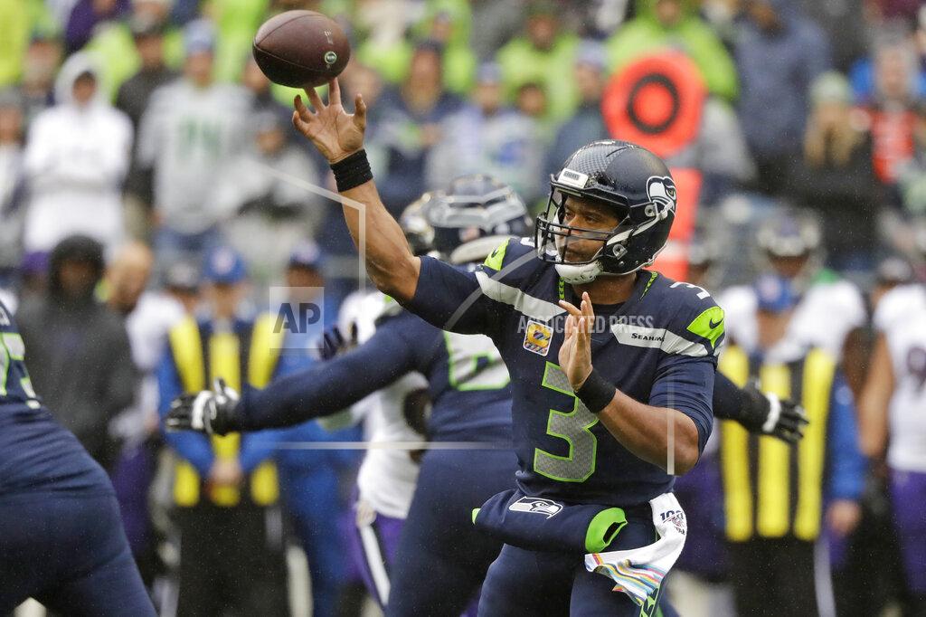 Elaine Thompson Seattle Seahawks quarterback Russell Wilson passes against the Baltimore Ravens during the first half of an NFL football game, Sunday, Oct. 20, 2019, in Seattle. (AP Photo/Elaine Thompson)