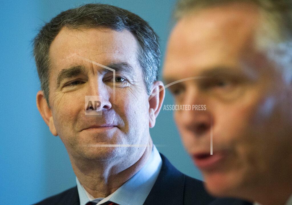 Steve Helber FILE - In this Jan. 9, 2018, file photo, former Virginia Gov. Terry McAuliffe, right, speaks to the media along with Gov. Ralph Northam at the Capitol in Richmond, Va. Northam announced Thursday, April 8, 2021, that he was backing Terry McAuliffe in the race to succeed him, handing his predecessor one of the contest's most coveted endorsements. (AP Photo/Steve Helber, File)