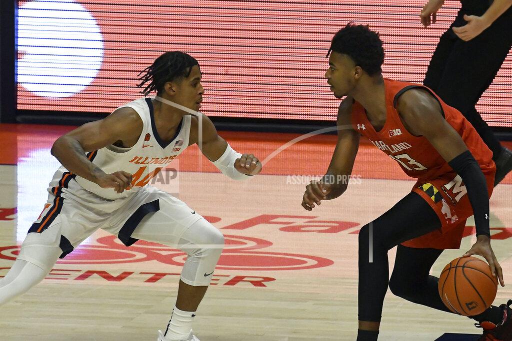 Holly Hart Maryland's guard Hakim Hart (13) drives the ball as Illinois guard Adam Miller (44) defends in the first half of an NCAA college basketball game Sunday, Jan. 10, 2021, in Champaign, Ill. (AP Photo/Holly Hart)