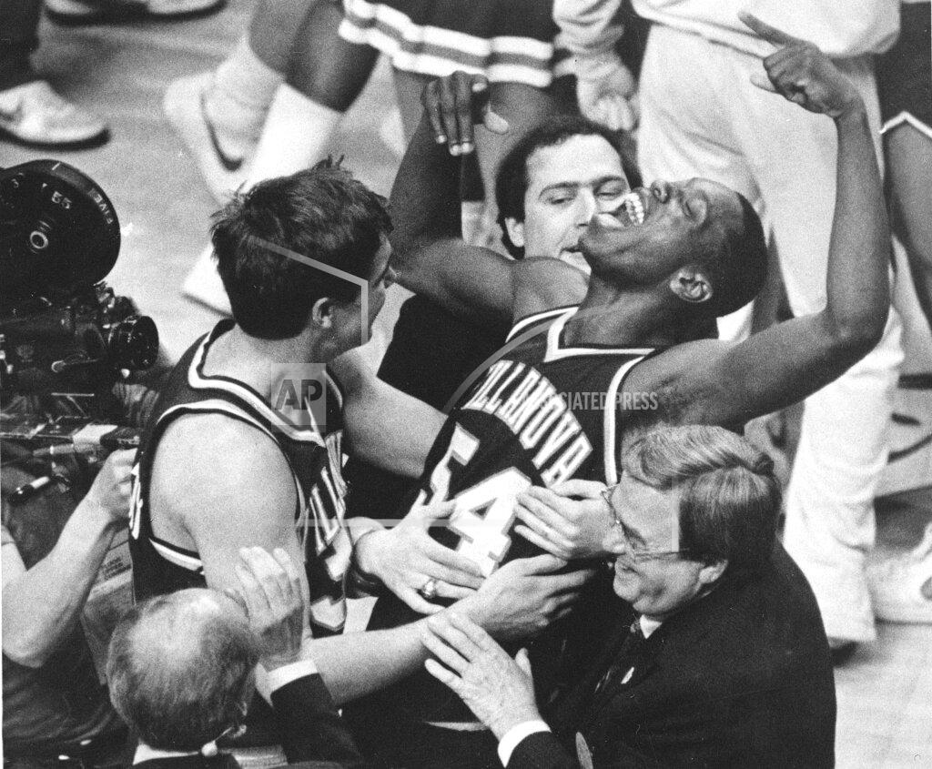 Gary Landers FILE - In this April 1, 1985, file photo, Villanova's Ed Pinckney (54) yells out as he is surrounded by teammates after the Wildcats defeated Georgetown for the national championship in the Final Four of the NCAA college basketball tournament in Lexington, Ky. (AP Photo/Gary Landers, File)