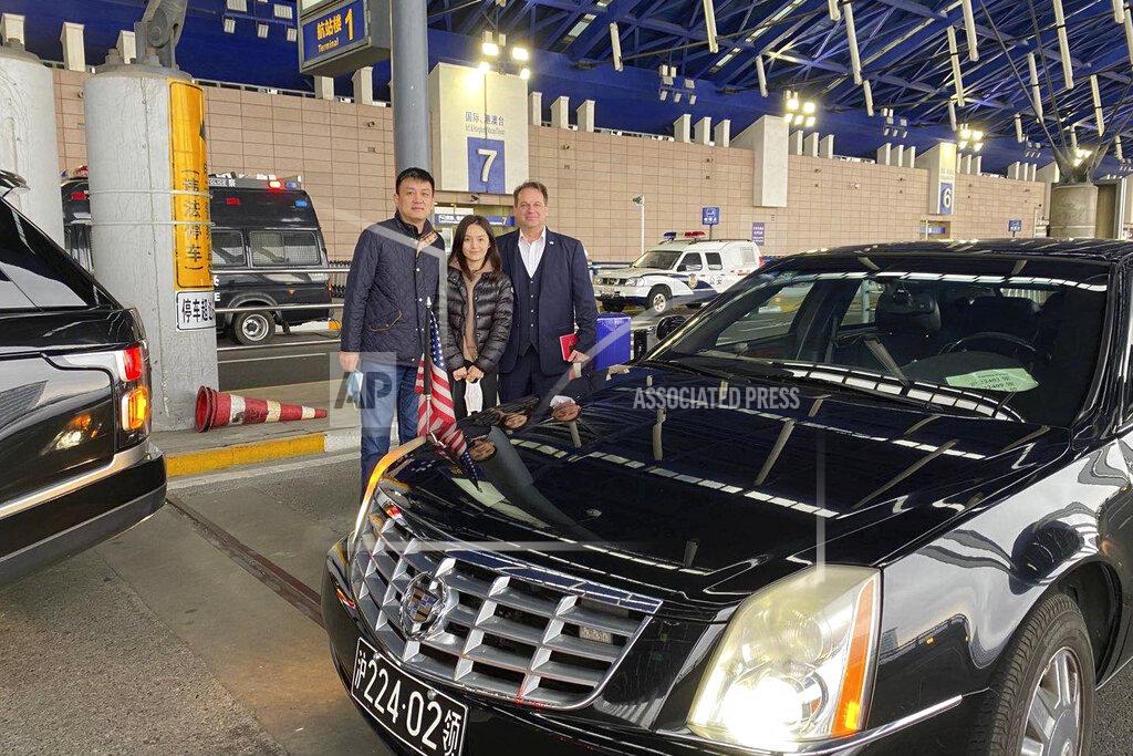 Uncredited This photo provided by Daniel Hsu shows him, his wife, Jodie Chen, and the U.S. Consul General in Shanghai Sean Stein before her flight home to her daughter in Seattle, after being blocked from leaving China for nearly three years. The U.S. diplomat escorted her to the departure gate. (Courtesy Daniel Hsu via AP)