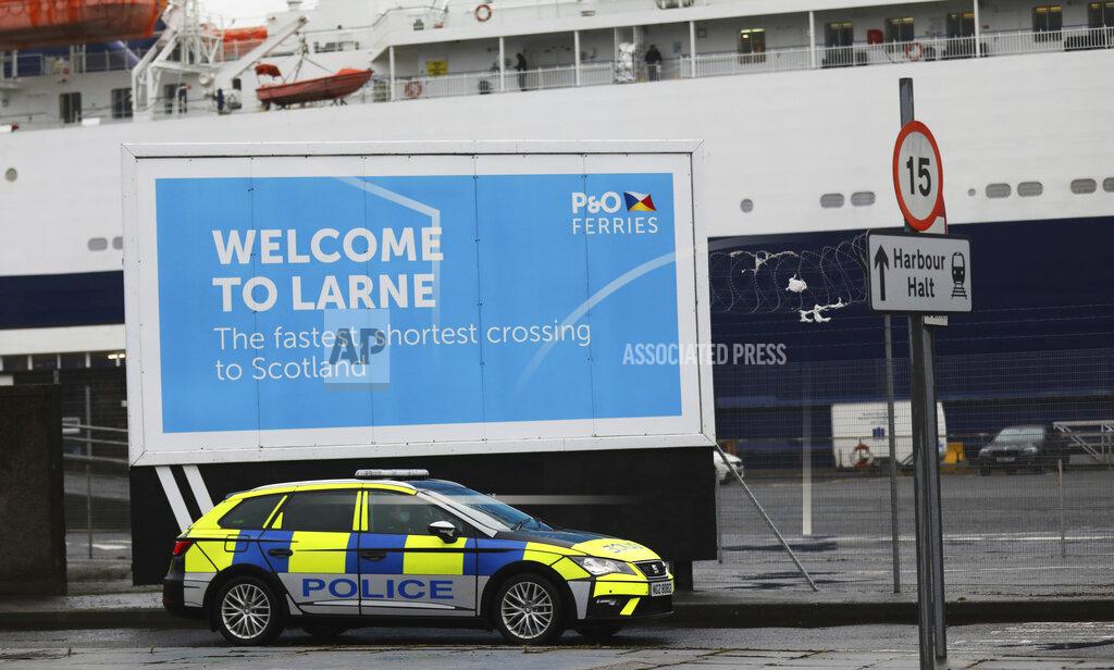 Peter Morrison Police patrol the port of Larne, Northern Ireland, Tuesday, Feb. 2, 2021. Authorities in Northern Ireland have suspended checks on animal products and withdrawn workers from two ports after threats against border staff. (AP Photo/Peter Morrison)