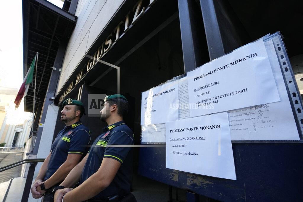 Antonio Calanni Italian Finance police officers stands outside the Genoa's Palace of Justice on the opening of the first hearing of the trial for the Morandi bridge collapse, Thursday, July 7, 2022. Forty-three people were killed when a large stretch of the Morandi Bridge broke off, August 14, 2018, on the eve of one of Italy's biggest vacation holidays. (AP Photo/Antonio Calanni)